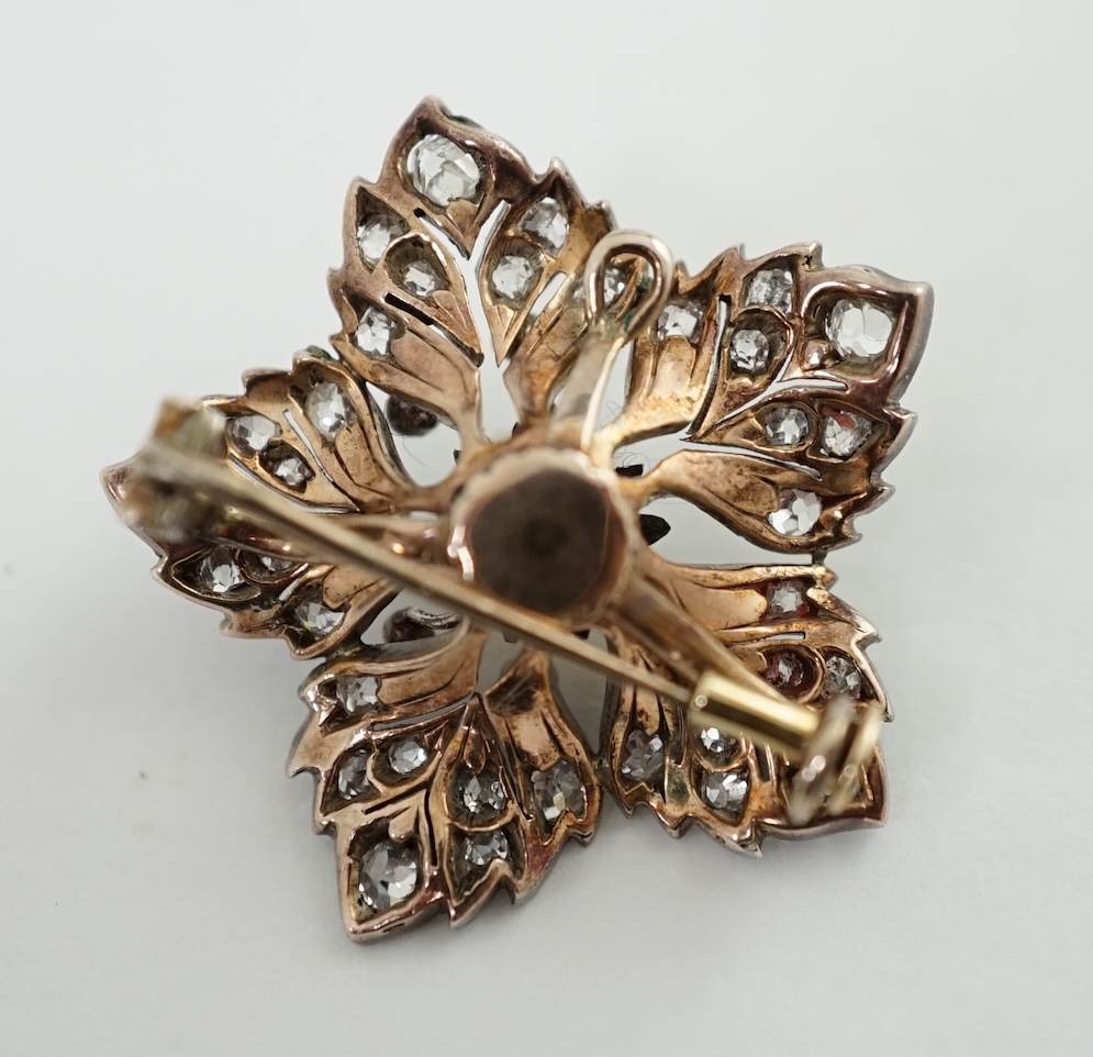 A Victorian gold and silver, pearl and diamond cluster set flower head pendant brooch